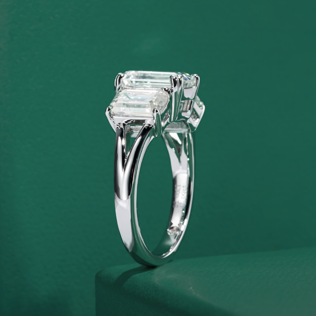 Trilogy Emerald Moissanite Ring