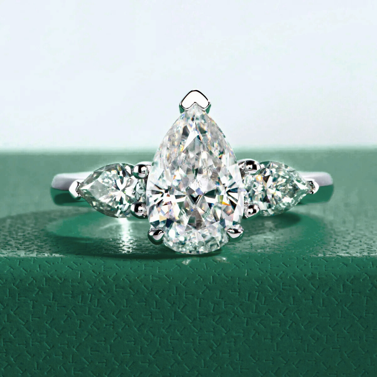 Trilogy Pear Moissanite Ring