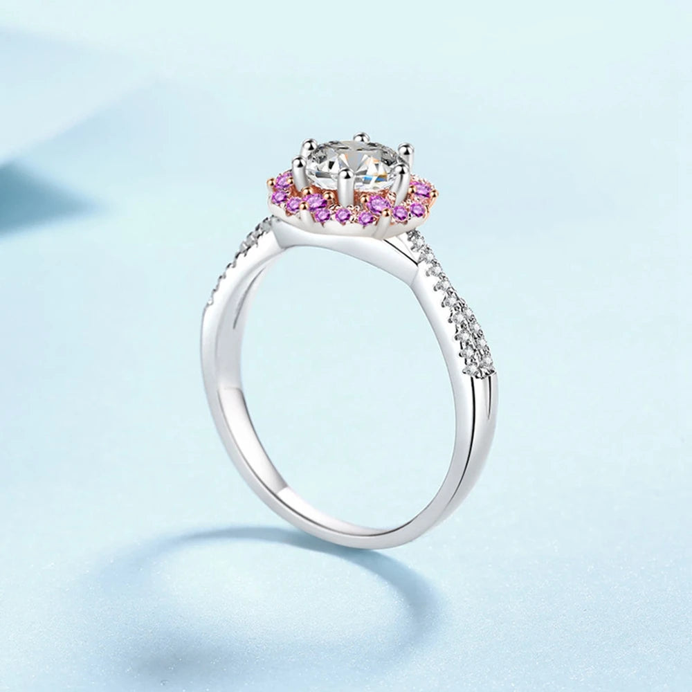 Éden Moissanite ring in silver with pink zirconia, featuring a central 1 ct moissanite stone and rose gold accents.