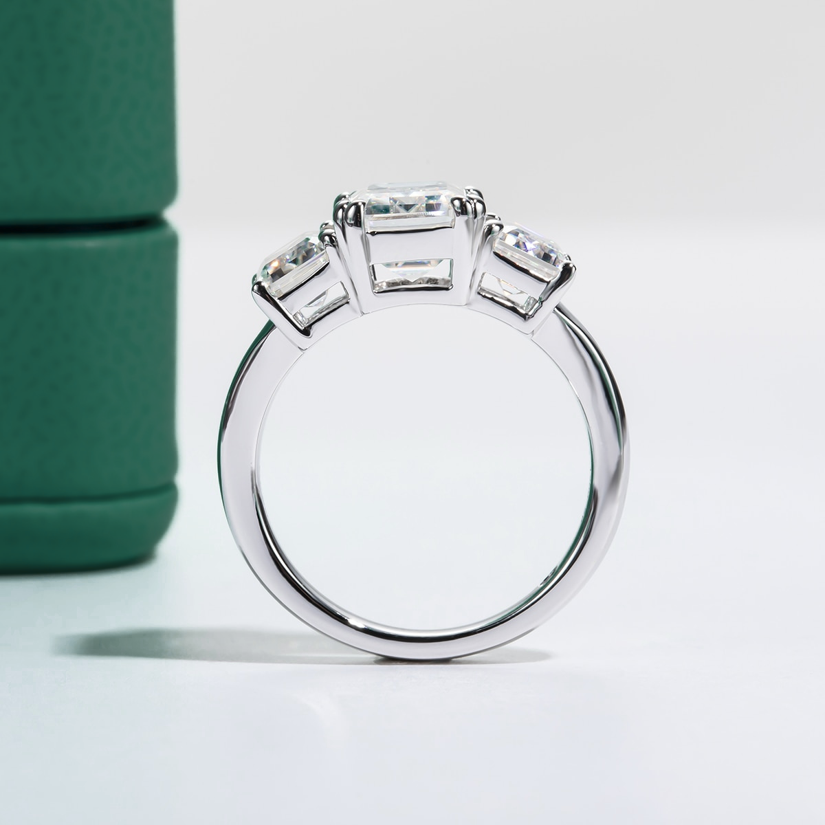 Trilogy Emerald Moissanite Ring 