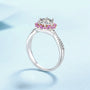 Éden Moissanite ring in silver with pink zirconia, featuring a central 1 ct moissanite stone and rose gold accents.